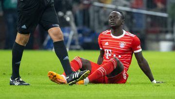 08 November 2022, Bavaria, Munich: Soccer: Bundesliga, FC Bayern Munich - SV Werder Bremen, Matchday 14 at the Allianz Arena: Sadio Mane of Munich sits on the pitch. A week and a half before the start of the World Cup, Bayern star recruit Sadio Mané had to be substituted after 20 minutes, stricken. How seriously Africa's Footballer of the Year is injured was an open question. Photo: Sven Hoppe/dpa - IMPORTANT NOTE: In accordance with the requirements of the DFL Deutsche Fußball Liga and the DFB Deutscher Fußball-Bund, it is prohibited to use or have used photographs taken in the stadium and/or of the match in the form of sequence pictures and/or video-like photo series. (Photo by Sven Hoppe/picture alliance via Getty Images)