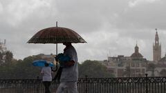 SEVILLE ANDALUSIA, SPAIN - SEPTEMBER 13: Two people walk under their umbrellas on the day that the Community of Andalusia has been put on yellow warning for storms and rain. On September 13, 2022, in Seville (Andalusia, Spain). The State Meteorological Agency (Aemet) has activated for this Tuesday, from the early morning, yellow alert for the possibility of heavy rainfall in the provinces of Cordoba, Huelva, Jaen and Seville. Specifically, from 00.00 hours in the early hours of Tuesday weighs yellow alert for heavy rainfall of up to 15 milliliters of water per hour in all areas of the provinces of Cordoba, Huelva and Seville. (Photo By Maria Jose Lopez/Europa Press via Getty Images)