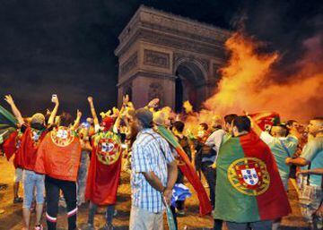 Fans celebrate Portugal's Euro 2016 win near the Arc de Triomphe in Paris, France, early July 11, 2016.   