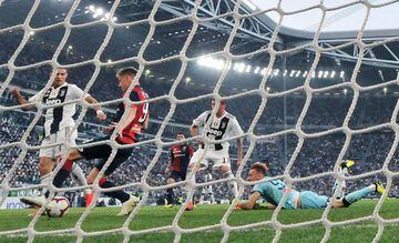 Ronaldo (left) gives Juventus the lead against Genoa.