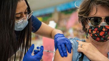 Fransella Kriestel receives her second Moderna vaccine at a vaccination site in San Antonio, Texas.