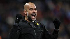 HUDDERSFIELD, ENGLAND - NOVEMBER 26: Pep Guardiola the head coach / manager of Manchester City celebrates as Raheem Sterling of Manchester City scores a goal to make it 1-2  during the Premier League match between Huddersfield Town and Manchester City at 