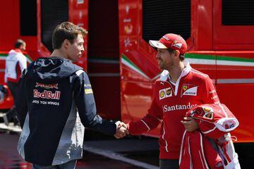 Sebastian Vettel chats to Daniil Kvyat at Circuit de Catalunya.