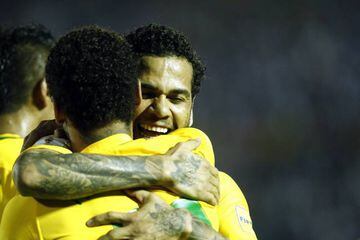 Brazil's Neymar given a big hug by Dani Alves after his goal gave a comfortable lead over Uruguay.