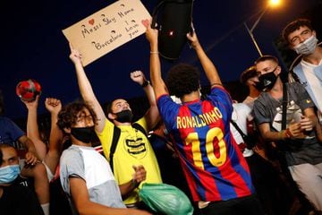 Barcelona fans protest outside the Camp Nou after captain Lionel Messi told Barcelona he wishes to leave the club immediately.