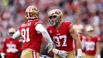 SANTA CLARA, CALIFORNIA - JANUARY 14: Arik Armstead #91 of the San Francisco 49ers celebrates with Nick Bosa #97 after sacking Geno Smith #7 of the Seattle Seahawks during the first quarter in the NFC Wild Card playoff game at Levi's Stadium on January 14, 2023 in Santa Clara, California.   Ezra Shaw/Getty Images/AFP (Photo by EZRA SHAW / GETTY IMAGES NORTH AMERICA / Getty Images via AFP)