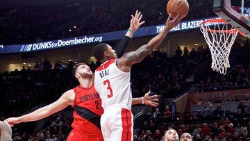 Dec 5, 2017; Portland, OR, USA; Washington Wizards guard Bradley Beal (3) shoots over Portland Trail Blazers center Jusuf Nurkic (27) during the first quarter at the Moda Center. Mandatory Credit: Craig Mitchelldyer-USA TODAY Sports