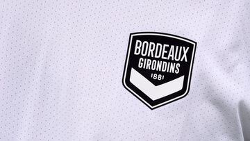 (FILES) This file photo taken on July 2, 2020 shows Girondins de Bordeaux new club logo on a player&#039;s jersey during the first training session of the football team in Le Haillan, near Bordeaux, southwestern France, following the interruption of the F