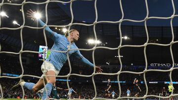 Manchester City's Norwegian striker Erling Haaland celebrates after scoring the opening goal in the English FA Cup quarter-final football match between Manchester City and Burnley at the Etihad Stadium in Manchester, north-west England, on March 18, 2023. (Photo by Oli SCARFF / AFP) / RESTRICTED TO EDITORIAL USE. No use with unauthorized audio, video, data, fixture lists, club/league logos or 'live' services. Online in-match use limited to 120 images. An additional 40 images may be used in extra time. No video emulation. Social media in-match use limited to 120 images. An additional 40 images may be used in extra time. No use in betting publications, games or single club/league/player publications. / 