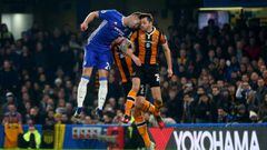 Gary Cahill of Chelsea bangs heads with Ryan Mason of Hull City during the Premier League match between Chelsea and Hull City