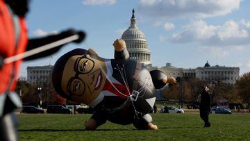 Demonstrators with MoveOn, stage a protest calling for the expulsion of U.S. Rep. George Santos (R-NY) featuring a large balloon version of Santos outside of the U.S. Capitol building Washington, U.S., November 28, 2023. REUTERS/Leah Millis