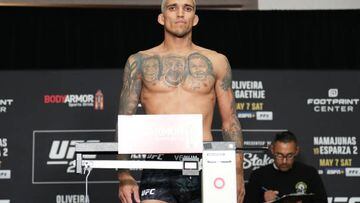 Charles Oliveira has been stripped of his UFC lightweight belt after he was found to be a half-pound too heavy for his title defense on Saturday.