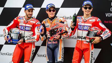 (From L-R) Second placed Andrea Dovizioso of Italy, winner Marc Marquez of Spain and third placed Jorge Lorenzo of Spain pose after the qualifying session of the MotoGP Austrian Grand Prix weekend at Red Bull Ring in Spielberg, Austria on August 12, 2017. / AFP PHOTO / Jure Makovec