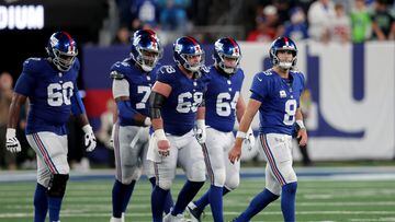 Oct 2, 2023; East Rutherford, New Jersey, USA; New York Giants quarterback Daniel Jones (8) walks off the field with guards Marcus McKethan (60) and Joshua Ezeudu (75) and Ben Bredeson (68) and Mark Glowinski (64) after being sacked during the fourth quarter against the Seattle Seahawks at MetLife Stadium. Mandatory Credit: Brad Penner-USA TODAY Sports