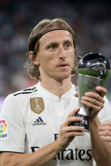 A Real contender | Madrid's Croatian midfielder Luka Modric holds the trophy for the Best FIFA Men's Player of 2018 Award.