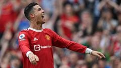 Manchester United&#039;s Portuguese striker Cristiano Ronaldo celebrates after scoring his third goal during the English Premier League football match between Manchester United and Norwich City at Old Trafford in Manchester, north west England, on April 1