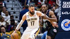 Apr 1, 2023; New Orleans, Louisiana, USA;  New Orleans Pelicans center Jonas Valanciunas (17) dribbles against LA Clippers forward Kawhi Leonard (2) during the second half at Smoothie King Center. Mandatory Credit: Stephen Lew-USA TODAY Sports