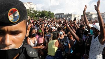People react during protests against and in support of the government, amidst the coronavirus disease in Havana, Cuba July 11, 2021.  