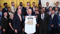 US President Joe Biden (C) is presented with a jersey while hosting the Houston Astros to celebrate their 2022 World Series victory, in the East Room of the White House in Washington, DC, on August 7, 2023. (Photo by Mandel NGAN / AFP)