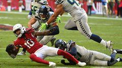 GLENDALE, ARIZONA - NOVEMBER 06: DeAndre Hopkins #10 of the Arizona Cardinals is tackled by Uchenna Nwosu #10 of the Seattle Seahawks in the second quarter of the game at State Farm Stadium on November 06, 2022 in Glendale, Arizona.   Norm Hall/Getty Images/AFP