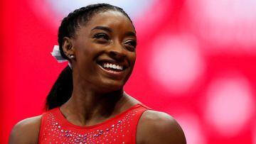 FILE PHOTO: Simone Biles smiles at a teammate during the final day of women&#039;s competition in the U.S. Olympic Team Trials for gymnastics in St. Louis, Missouri, U.S., June 27, 2021.  REUTERS/Lindsey Wasson/File Photo
