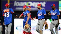 Puerto Rico players celebrate after defeating Venuezuela in the Caribbean Series baseball game between Puerto Rico and Venezuela at LoanDepot Park in Miami, Florida, on February 4, 2024. (Photo by Chandan Khanna / AFP)