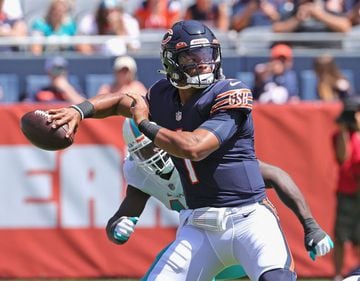 Justin Fields of the Chicago Bears passes against the Miami Dolphins during a preseason game at Soldier Field on August 14, 2021 in Chicago, Illinois.