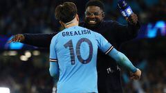 Soccer Football - Champions League - Semi Final - Second Leg - Manchester City v Real Madrid - Etihad Stadium, Manchester, Britain - May 17, 2023 Manchester City's Jack Grealish celebrates with TV pundit Micah Richards after the match REUTERS/Molly Darlington