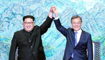 North Korean leader Kim Jong Un (L) and South Korean President Moon Jae-in (R) pose for photographs after signing the Panmunjom Declaration for Peace, Prosperity and Unification of the Korean Peninsula - 27 April 2018.