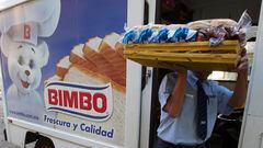 A Grupo Bimbo employee, carries some products for delivery to a restaurant in the Zona Rosa area in Mexico city, Mexico on Thrusday Feb.14, 2013. Bimbo a Mexican company that is the world's largest bread baker Photographer: Susana González/Bloomberg