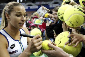 Cibulkova puts her autograph on some big balls after her final win.