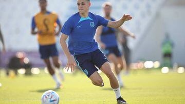 DOHA, QATAR - NOVEMBER 28: Phil Foden of England runs with the ball during a training session at Al Wakrah Stadium on November 28, 2022 in Doha, Qatar. (Photo by Eddie Keogh - The FA/The FA via Getty Images)