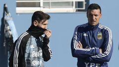 Argentina's forward Lionel Messi (L) and assistant coach Lionel Scaloni gesture during a training session in Ezeiza, Buenos Aires on May 22, 2018, ahead of the Russia 2018 World Cup football tournament.