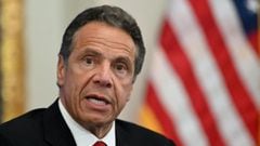 (FILES) In this file photo taken on May 26, 2020, New York Governor Andrew Cuomo speaks during a press conference at the New York Stock Exchange on Wall Street in New York City. - The number of Democrats calling on Cuomo to resign over sexual harassment a