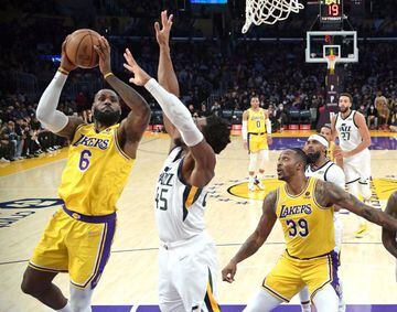 Jan 17, 2022; Los Angeles, California, USA; Los Angeles Lakers forward LeBron James (6) is defended by Utah Jazz guard Donovan Mitchell (45) as he goes up for a basket in the first half at Crypto.com Arena. Mandatory Credit: Jayne Kamin-Oncea-USA TODAY Sp