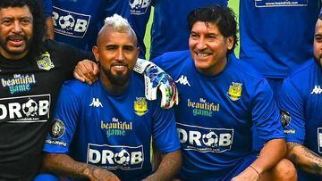 Team RC3 Brazilian football player Roberto Carlos (L) pose for a photo during "The Beautiful Game" a celebrity football match at DRV PNK stadium in Fort Lauderdale, Florida on June 18, 2022. (Photo by CHANDAN KHANNA / AFP)