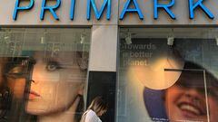 FILE PHOTO: A woman walks past a window display at a Primark store in Liverpool, Britain, September 15, 2021. REUTERS/Phil Noble/File Photo