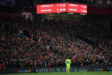 Messi looks dejected as the scoreboard reads '4-0' during Barcelona's Champions League elimination by Liverpool on Tuesday.