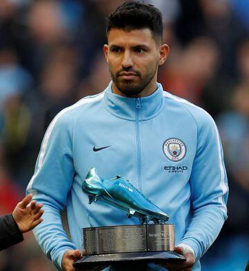 Manchester City's Sergio Aguero receives an award after becoming the clubs all time leading goalscorer before the match