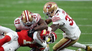 LAS VEGAS, NEVADA - FEBRUARY 11: Jerick McKinnon #1 of the Kansas City Chiefs is stopped by Dre Greenlaw #57 and Logan Ryan #33 of the San Francisco 49ers in the first quarter during Super Bowl LVIII at Allegiant Stadium on February 11, 2024 in Las Vegas, Nevada.   Harry How/Getty Images/AFP (Photo by Harry How / GETTY IMAGES NORTH AMERICA / Getty Images via AFP)