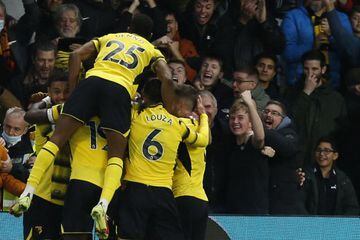 Watford's Ismaila Sarr celebrates with team mates after scoring his team's second goal Manchester United.