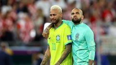 Soccer Football - FIFA World Cup Qatar 2022 - Quarter Final - Croatia v Brazil - Education City Stadium, Doha, Qatar - December 9, 2022 Brazil's Neymar and Dani Alves look dejected after losing the penalty shootout REUTERS/Hannah Mckay     TPX IMAGES OF THE DAY