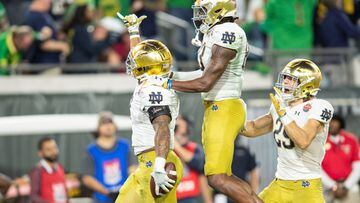 Dec 30, 2022; Jacksonville, FL, USA; Notre Dame Fighting Irish running back Logan Diggs (3), wide receiver Jayden Thomas (83) and wide receiver Matt Salerno (29) celebrate a touchdown against the South Carolina Gamecocks in the fourth quarter in the 2022 Gator Bowl at TIAA Bank Field. Mandatory Credit: Jeremy Reper-USA TODAY Sports