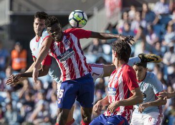 Thomas Partey jumps for the ball.