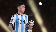 Argentina's midfielder #24 Enzo Fernandez receives the Young Player award during the Qatar 2022 World Cup trophy ceremony after the football final match between Argentina and France at Lusail Stadium in Lusail, north of Doha on December 18, 2022. - Argentina won in the penalty shoot-out. (Photo by FRANCK FIFE / AFP)