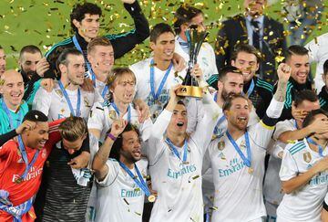 Real Madrid’s Cristiano Ronaldo and team mates celebrate winning the FIFA Club World Cup with the trophy