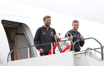 Liverpool arrive back in Liverpool with the Champions League trophy