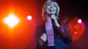 FILE PHOTO: Olivia Newton-John sings at her "Greatest Hits Live" concert in Hong Kong August 18, 2000. The 51-year-old singer will perform with Australian singer John Farnham at the opening ceremony of the Sydney 2000 Olympic Games in September. Reuters/Reuters Photographer/File Photo