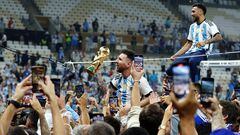 Soccer Football - FIFA World Cup Qatar 2022 - Final - Argentina v France - Lusail Stadium, Lusail, Qatar - December 18, 2022 Argentina's Lionel Messi celebrates with the trophy after winning the World Cup REUTERS/Lee Smith