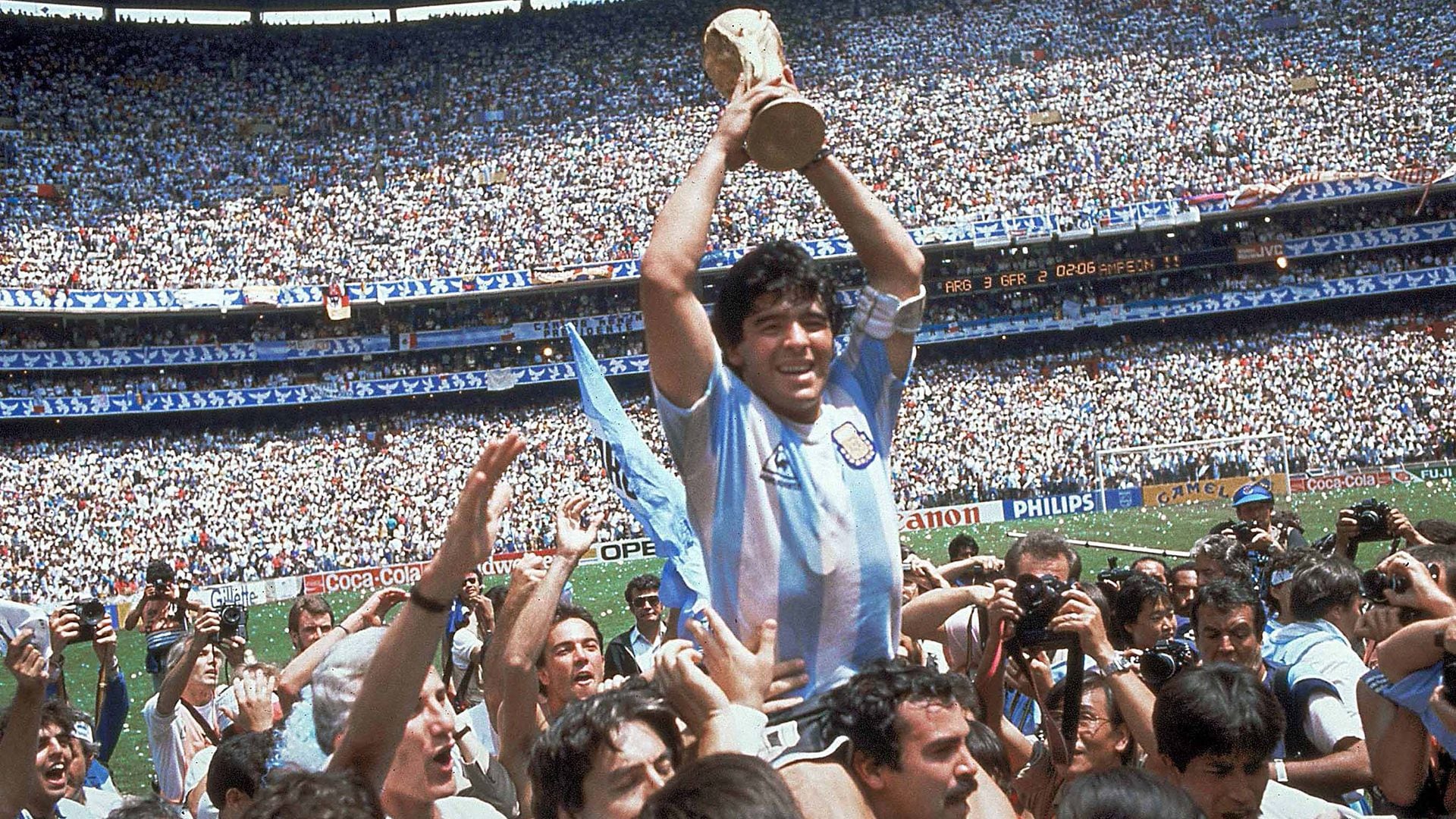**  FILE  ** Argentina's Diego Maradona, holding up the trophy, is carried on shoulders as he celebrates at the end of the World Cup soccer final game against West Germany at the Atzeca Stadium, in Mexico City, in this June 29, 1986, file photo. Argentina won 3-2. Maradona and Argentinean coach Carlos Bilardo have been asked to lead Argentina by Julio Grondona, head of the Argentine Football Association, Tuesday, Oct. 28, 2008. (AP Photo/Carlo Fumagalli, file)